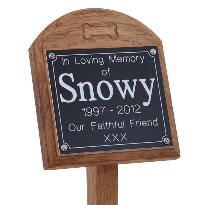 4 x 4 memorial oak pet ground stake with black plaque and white text and carved bone