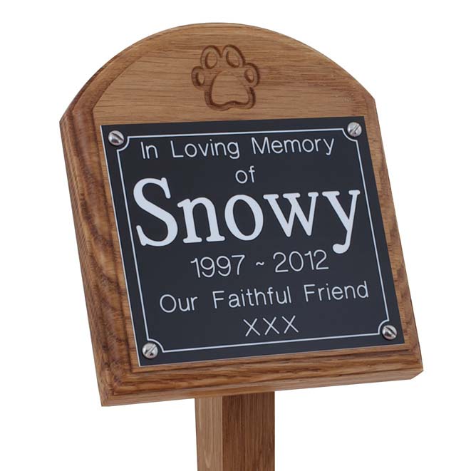 4 x 4 memorial oak pet ground stake with black plaque, white text, carved paw print