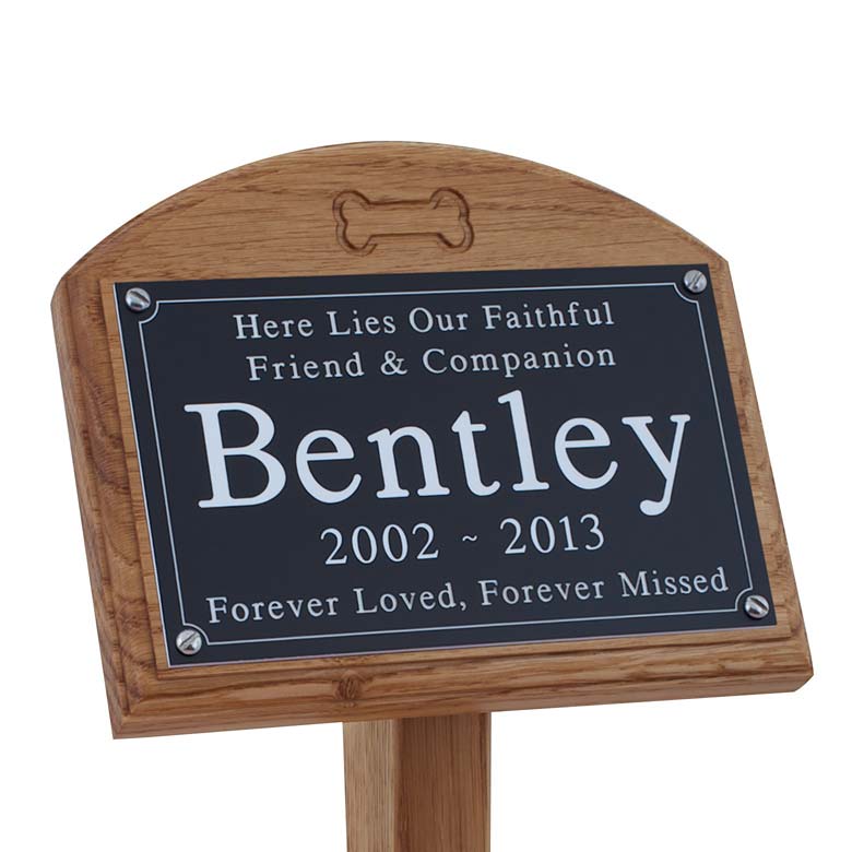 7x5 oak memorial pet ground stake with black plaque, white text and carved bone