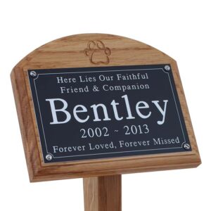 7x5 oak memorial pet ground stake with black plaque with white text and carved paw print